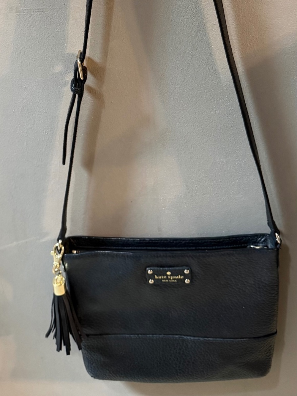BLack pebbled leather Kate Spade Bay Street Cora crossbody purse with tassel